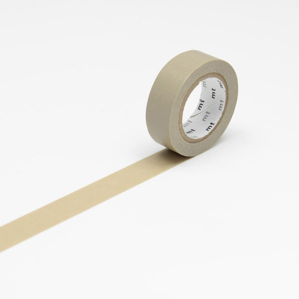 Beige är färgen på avdelningen. En utrullad beige washi tape. - Tidformera