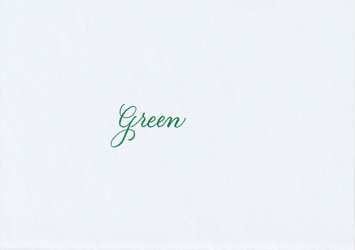 Handskriven text med ordet "Green" i grön färg, skrivet med Pentel Brush Sign Pen i färgen Green.