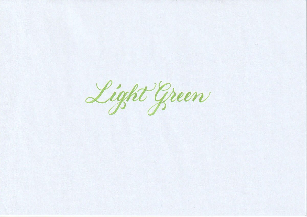 Handskriven text med orden "Light Green" i ljusgrön färg, skriven med Pentel Brush Sign Pen i färgen Light Green.