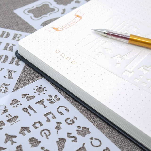 Dotted Journal Stencil Set 12 - pack från Peter Pauper Press - På bild används stencilerna i en anteckningsbok - Tidformera
