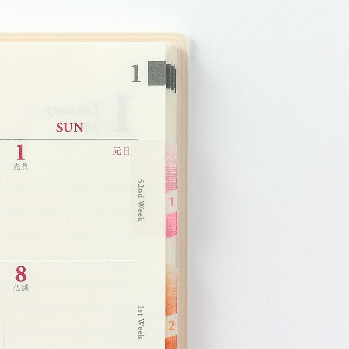 En uppslagen kalender med indexflikar insatta. Indexflikarna har nummer ett och två på.  - Tidformera