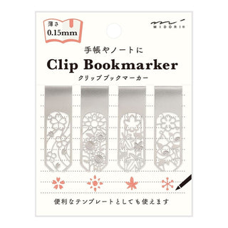 Förpackning med fyra bokmärken med olika motiv med blommor. Clip Bookmarker - Flower från Midori.