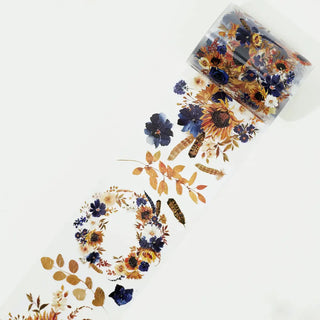 Pet tape Sunflower & Navy - 60 mm -frÄn The Washi Tape Shop. En rulle med clear tape som har blommor i gult och blÄtt. - Tidformera