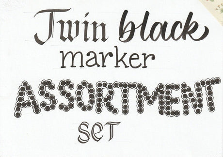 Twin Black marker Assortment handskrivet med pennor i setet. Tidformera