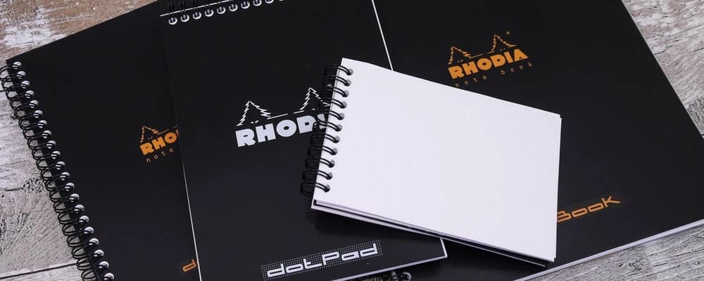 Rhodia - Spiralblock i olika format ligger på varandra. Tidformera