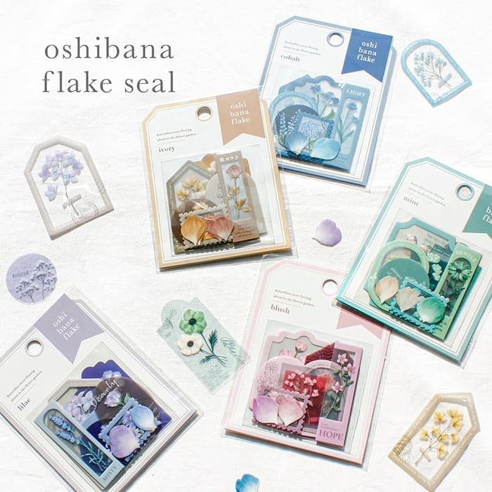 Förpackningar med Oshi Bana flake stickers från Mind Wave - Tidformera