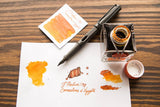 Swatches med det orangea bäcket Cornaline d'Egypte från Herbin - Tidformera