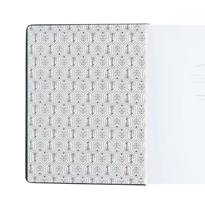 Insidan på pärmen på Coiled Key dotted notebook från Archer & Olive. Tidformera