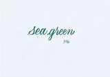 Handskriven text med orden "sea green" i havsgrön färg, skriven med ABT Dual Brush Pen i nyansen 346 Sea Green.
