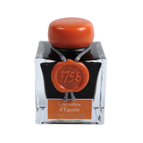 Bläckflaska J. HERBIN INK 50 ml - Cornaline d'Egypte (Carnelian of Egypt)från Herbin. Glasflaskan är fylld med orange bläck. - Tidformera