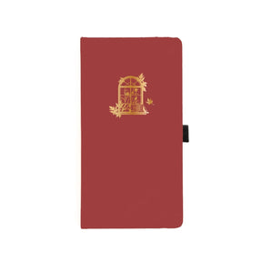 Röd prickad anteckningsbok med guldfärgat motiv - ett fönster med böcker och växt. Dotted Notebook Limited Edition Style Fall 2024 Slim - från Archer & Olive - Tidformera