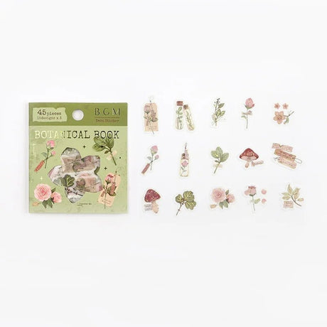 Flake stickers Botanical picture book från BGM. Förpackning med klistermärken och stickers ligger bredvid. De har motiv med blommor, växter och svampar. - Tidformera