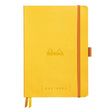 GoalBook Dotted notebook A5 - Daffodil yellow från Rhodia - Gul anteckningsbok. Boken har 2 bokmärkesband samt en orange gummiband för stängning och pennhållare. - Tidformera