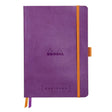 GoalBook Dotted notebook A5 - Purple från Rhodia - Lila anteckningsbok. Boken har 2 bokmärkesband samt en orange gummiband för stängning. - Tidformera