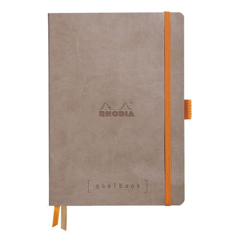 GoalBook Dotted notebook A5 - Taupe från Rhodia - Beige anteckningsbok. Boken har 2 bokmärkesband samt en orange gummiband för stängning och pennhållare.
- Tidformera