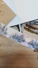 Video där vi använder Snowland washi tape från Plan and Plot Studio för att dekorera vinterbingo-uppslag i en dotted notebook. Tidformera