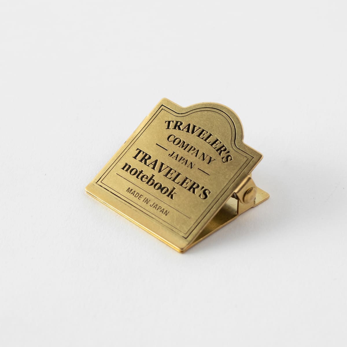 TN Brass Clip 030. TRC Logo - Traveler's Company - Tidformera